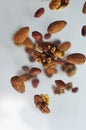 Nuts in the air on a white background, flying nuts. Healthy Brain Food, Diet, Protein, Almonds, walnuts and hazelnuts Royalty Free Stock Photo