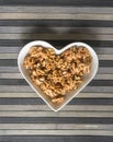 Nuts arranged in heart on background. Healthy Food image close up walnuts nuts. Love Texture