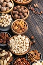 Nuts in assortment, Walnuts, pecans, almonds and other. Healthy food snack mix on wooden table background, top view Royalty Free Stock Photo