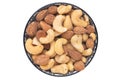 Nuts background. Close-up of roasted and salted almonds and cashew nuts in a ceramic bowl isolated on a white background. Gourmet Royalty Free Stock Photo