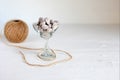 Nuts balls in stylish, transparent glass bowl with brown rope , on the white surface. Close up taken. Luxury tasty nuts Royalty Free Stock Photo