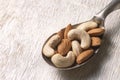 nuts in silver spoon