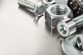 Nuts, bolts, screws, washers, bearings on a metal steel background Royalty Free Stock Photo