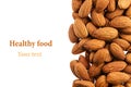 Nuts border of almonds on white background. Pile of selected almond close-up. Royalty Free Stock Photo