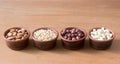 Nuts in clay bowls on a wooden table