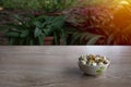 Nuts in a cup on an old wood grain table left corner and take a closeup and slope view, right copyspace for text input, the photo