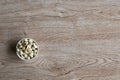 Nuts in a cup on an old wood grain table Left corner and take a closeup and top view, has copyspace for text input, the photo is a Royalty Free Stock Photo