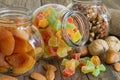 Nuts and dried fruit mix in jars assortment of delicacies Royalty Free Stock Photo