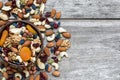 Nuts and dried fruits in a bowl over rustic wooden table Royalty Free Stock Photo