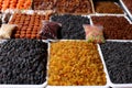 Nuts and dried fruits, on the market counter.