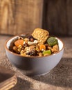 Nuts and dried fruits, oat biscuits in bowl, products for boost immunity system, selective focus closeup