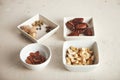 Nuts and dried fruits in small bowls Royalty Free Stock Photo