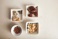 Nuts and dried fruits in small bowls Royalty Free Stock Photo