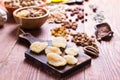 Nuts and dry fruit, in bowls, on boards