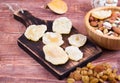 Nuts and dry fruit, in bowls, on boards