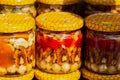 Nuts in honey, closed in jars