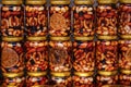 Nuts with honey in glass jars. Harvest of nuts. Delicacy and Healthy food. Homemade preservation in autumn