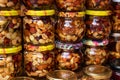 Nuts with honey in glass jars. Harvest of nuts. Delicacy and Healthy food. Homemade preservation in autumn