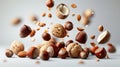 Nuts in mid air, gracefully levitating and falling elegantly on a clean white background Royalty Free Stock Photo
