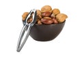 Nuts mix in brown plate and silver nutcracker Royalty Free Stock Photo