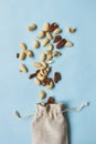 Nuts mix. Cashews, almonds and pecans on the blue background, top view