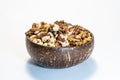 Nuts mix in a wooden bowl of coconut Royalty Free Stock Photo