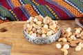 Nuts are mixed in a copper bowl. Healthy food and snack. A mixture of peanuts, pistachios, almonds, hazelnuts and cashews Royalty Free Stock Photo