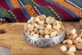 Nuts are mixed in a copper bowl. Healthy food and snack. A mixture of peanuts, pistachios, almonds, hazelnuts and cashews Royalty Free Stock Photo