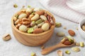 Nuts mixed in wood bowl on linen cloth Royalty Free Stock Photo