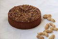 Nuts and peanuts cake on a white linen table cloth Royalty Free Stock Photo