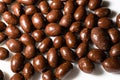 Nuts peanuts in chocolate glaze on a white background. Royalty Free Stock Photo