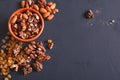 Nuts and raisins at black background. Healthy source of fat for vegans and vegetarians Royalty Free Stock Photo