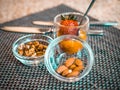 Nuts and strawberries in glass bowls. delicious snacks for breakfast