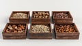 nuts, such as walnuts and hazelnuts, presented in wooden boxes, with a background of various whole peanuts arranged on Royalty Free Stock Photo