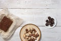 Nuts, truffle candy and chocolate cake on the white background Royalty Free Stock Photo