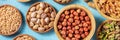 Nuts variety panoramic banner. Hazelnuts, pistachios, pine nuts and walnuts