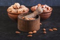 Nuts, walnuts, almonds and hazelnuts in utensils and mortar