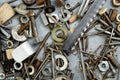 Nuts, washers, bolts, screws of various sizes and shapes over the plain background. A set for the mechanic. Royalty Free Stock Photo