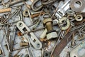 Nuts, washers, bolts, screws of various sizes and shapes over the plain background. A set for the mechanic. Royalty Free Stock Photo