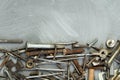 Nuts, washers, bolts, screws of various sizes and shapes over the plain background. A set for the mechanic. Royalty Free Stock Photo