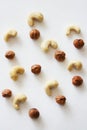 Nuts on white background as pattern, top view.