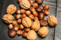 Nuts on a wooden black table Royalty Free Stock Photo