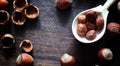 Nuts on a wooden table.Hazelnuts in the shells and shelled. A wo Royalty Free Stock Photo
