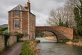 Nutshell Bridge and adjoining house on the Stroudwater Navigation near Stonehouse Stroud, England.