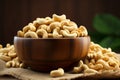 Nutty delight Cashews in a wooden bowl over burlap fabric