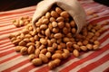 Nutty elegance Peanuts arranged tastefully on a rustic wrapping cloth