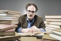 Nutty Professor in between a stack of books Royalty Free Stock Photo