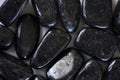 Nuumite, Nummite Tumbled Stones Close up Royalty Free Stock Photo