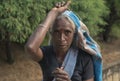 NUWARA ELIYA, SRI LANKA - January 14 : Tea picker woman portrait female on the road near tea factory