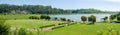 Nuwara Eliya, Sri Lanka - March 10, 2022: Panoramic view of the green landscape in Gregory Park and the lake on a sunny day